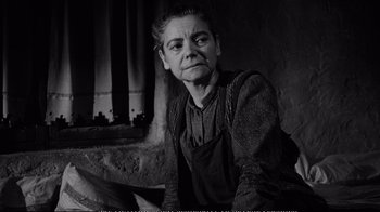 Movie still from “America America” (1963), directed by Elia Kazan – An older woman sitting in front of a window; Close Up shot, Low angle