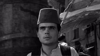Movie still from “America America” (1963), directed by Elia Kazan – A black and white photo of a man wearing a fez; Close Up shot, Low angle
