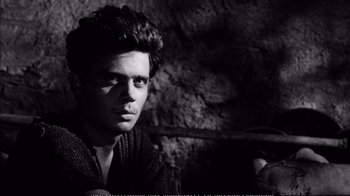 Movie still from “America America” (1963), directed by Elia Kazan – A black and white photo of a man in a sweater; Close Up shot, High angle