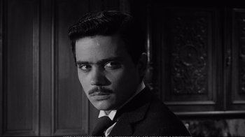 Movie still from “America America” (1963), directed by Elia Kazan – A black and white photo of a man with a mustache; Close Up shot, High angle