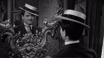 Movie still from “America America” (1963), directed by Elia Kazan – A black and white photo of a man looking at himself in the mirror; Medium shot, Over the shoulder angle