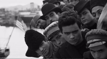 Movie still from “America America” (1963), directed by Elia Kazan – A black and white photo of a group of people; Medium shot, High angle