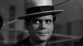 Movie still from “America America” (1963), directed by Elia Kazan – A black and white photo of a man wearing a hat; Close Up shot, High angle