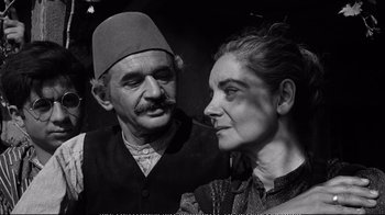Movie still from “America America” (1963), directed by Elia Kazan – An older man and woman posing for a picture; Close Up shot, High angle