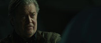 Movie still from “American Dharma” (2018), directed by Errol Morris – An older man sitting in front of a mirror; Close Up shot, Over the shoulder angle