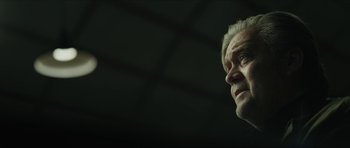 Movie still from “American Dharma” (2018), directed by Errol Morris – An older man is looking into the distance; Close Up shot, Low angle