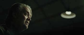 Movie still from “American Dharma” (2018), directed by Errol Morris – An older man with white hair looking into the distance; Close Up shot, Low angle
