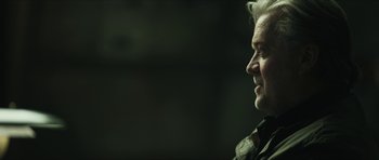 Movie still from “American Dharma” (2018), directed by Errol Morris – A person looking at something; Close Up shot, Over the shoulder angle