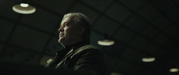 Movie still from “American Dharma” (2018), directed by Errol Morris – A person wearing a jacket; Close Up shot, Low angle