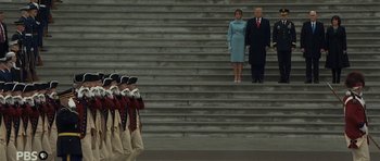 Movie still from “American Dharma” (2018), directed by Errol Morris – President trump and first lady walking down the stairs; Extreme Wide shot, Low angle