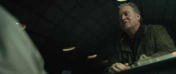 Movie still from “American Dharma” (2018), directed by Errol Morris – A man sitting in front of a ceiling; Close Up shot, Low angle