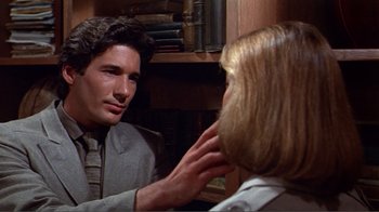 Movie still from “American Gigolo” (1980), directed by Paul Schrader – A man and a woman looking at each other in a room; Close Up shot, Over the shoulder angle