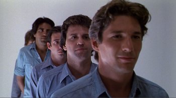 Movie still from “American Gigolo” (1980), directed by Paul Schrader – A group of young men standing next to each other; Close Up shot, Low angle