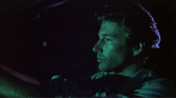 Movie still from “American Gigolo” (1980), directed by Paul Schrader – A person in the dark; Close Up shot, Low angle