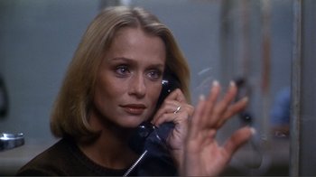 Movie still from “American Gigolo” (1980), directed by Paul Schrader – A woman talking on a phone while holding her hand up to her ear; Close Up shot, Over the shoulder angle