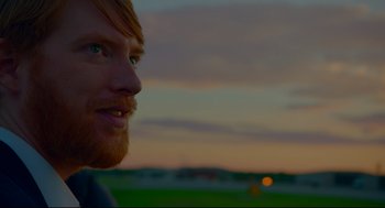 Movie still from “American Made” (2017), directed by Doug Liman – A person with a beard; Close Up shot, Over the shoulder angle