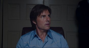 Movie still from “American Made” (2017), directed by Doug Liman – A man sitting in a chair looking up at the ceiling; Close Up shot, Low angle