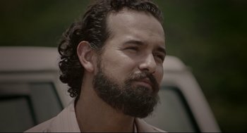 Movie still from “American Made” (2017), directed by Doug Liman – A person with a beard; Close Up shot, Over the shoulder angle