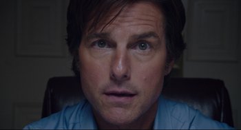 Movie still from “American Made” (2017), directed by Doug Liman – A man's face as he stares into the camera; Close Up shot, Low angle
