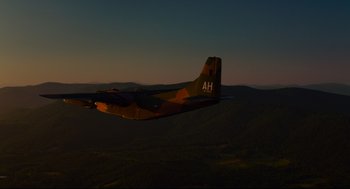 Movie still from “American Made” (2017), directed by Doug Liman – An airplane is sitting in the middle of a field; Extreme Wide shot, High angle