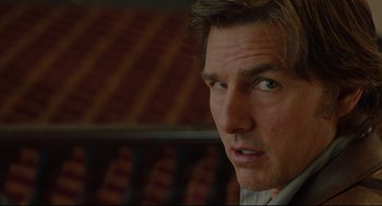 Movie still from “American Made” (2017), directed by Doug Liman – A man's face in front of a wall; Close Up shot, Over the shoulder angle