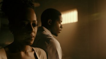 Movie still from “Snowfall” (2017), directed by Hiro Murai – A man and a woman standing next to each other; Close Up shot, Low angle