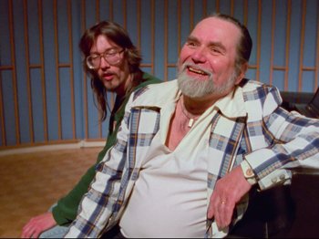 A man and a woman sitting next to each other