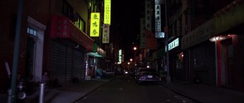 Movie still from “American Psycho” (2000), directed by Mary Harron – A car is parked on the side of the street; Extreme Wide shot, High angle