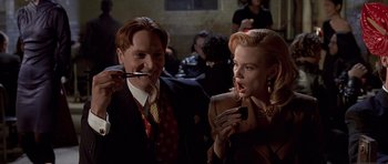 Movie still from “American Psycho” (2000), directed by Mary Harron – A man and a woman are smoking a cigarette; Close Up shot, Over the shoulder angle