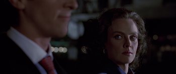 Movie still from “American Psycho” (2000), directed by Mary Harron – A man and a woman looking at each other in the dark; Close Up shot, Over the shoulder angle