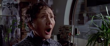 Movie still from “American Psycho” (2000), directed by Mary Harron – An older woman with her mouth open looking surprised; Close Up shot, Low angle