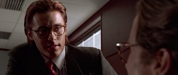 Movie still from “American Psycho” (2000), directed by Mary Harron – A person wearing a suit and tie; Close Up shot, Low angle