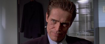 Movie still from “American Psycho” (2000), directed by Mary Harron – A person wearing a suit and tie; Close Up shot, Over the shoulder angle