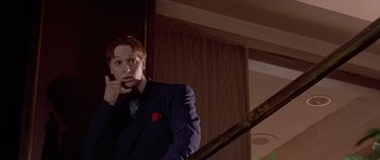 Movie still from “American Psycho” (2000), directed by Mary Harron – A man in a suit and red bow tie; Close Up shot, Low angle