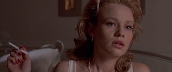 Movie still from “American Psycho” (2000), directed by Mary Harron – A person wearing a white shirt; Close Up shot, Low angle