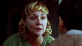 Movie still from “American Splendor” (2003), directed by Shari Springer Berman – An older woman with blonde hair looking at a younger woman; Close Up shot, Over the shoulder angle