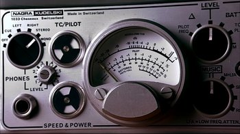 Movie still from “American Splendor” (2003), directed by Shari Springer Berman – An analog meter is shown in a close - up image; Extreme Close Up shot, Overhead angle