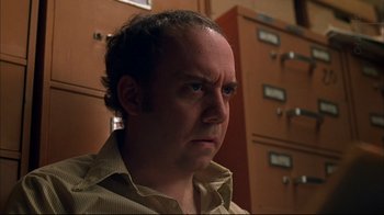 Movie still from “American Splendor” (2003), directed by Shari Springer Berman – A person in a room; Close Up shot, Low angle
