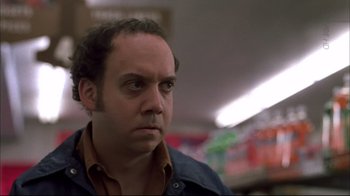Movie still from “American Splendor” (2003), directed by Shari Springer Berman – A person wearing a jacket and looking to his left; Close Up shot, Low angle