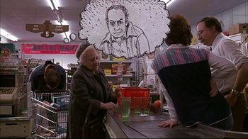 Movie still from “American Splendor” (2003), directed by Shari Springer Berman – An old woman at the counter of a grocery store; Medium shot, Over the shoulder angle