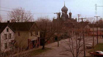 Movie still from “American Splendor” (2003), directed by Shari Springer Berman – An image of an old church in the middle of a city; Extreme Wide shot, High angle