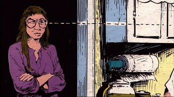 Movie still from “American Splendor” (2003), directed by Shari Springer Berman – A woman standing in front of a window with her arms crossed; Medium shot, Low angle