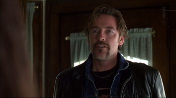 Movie still from “American Splendor” (2003), directed by Shari Springer Berman – A person wearing a leather jacket; Close Up shot, Low angle