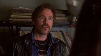 Movie still from “American Splendor” (2003), directed by Shari Springer Berman – A person wearing a leather jacket; Close Up shot, Over the shoulder angle