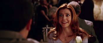 Movie still from “American Wedding” (2003), directed by Jesse Dylan – A person with long red hair; Close Up shot, Over the shoulder angle