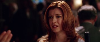 Movie still from “American Wedding” (2003), directed by Jesse Dylan – A person with long hair; Close Up shot, Over the shoulder angle