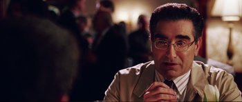 Movie still from “American Wedding” (2003), directed by Jesse Dylan – A person wearing a suit and tie; Close Up shot, Over the shoulder angle