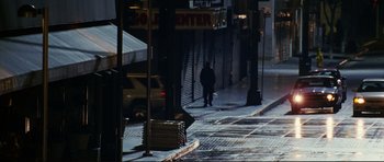 Movie still from “American Wedding” (2003), directed by Jesse Dylan – A person walking down a street at night; Extreme Wide shot, High angle