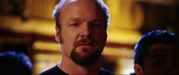 Movie still from “American Wedding” (2003), directed by Jesse Dylan – A person with a beard; Close Up shot, Low angle