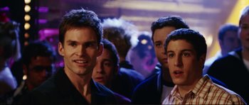 Movie still from “American Wedding” (2003), directed by Jesse Dylan – A group of young men standing next to each other in a room; Close Up shot, Over the shoulder angle